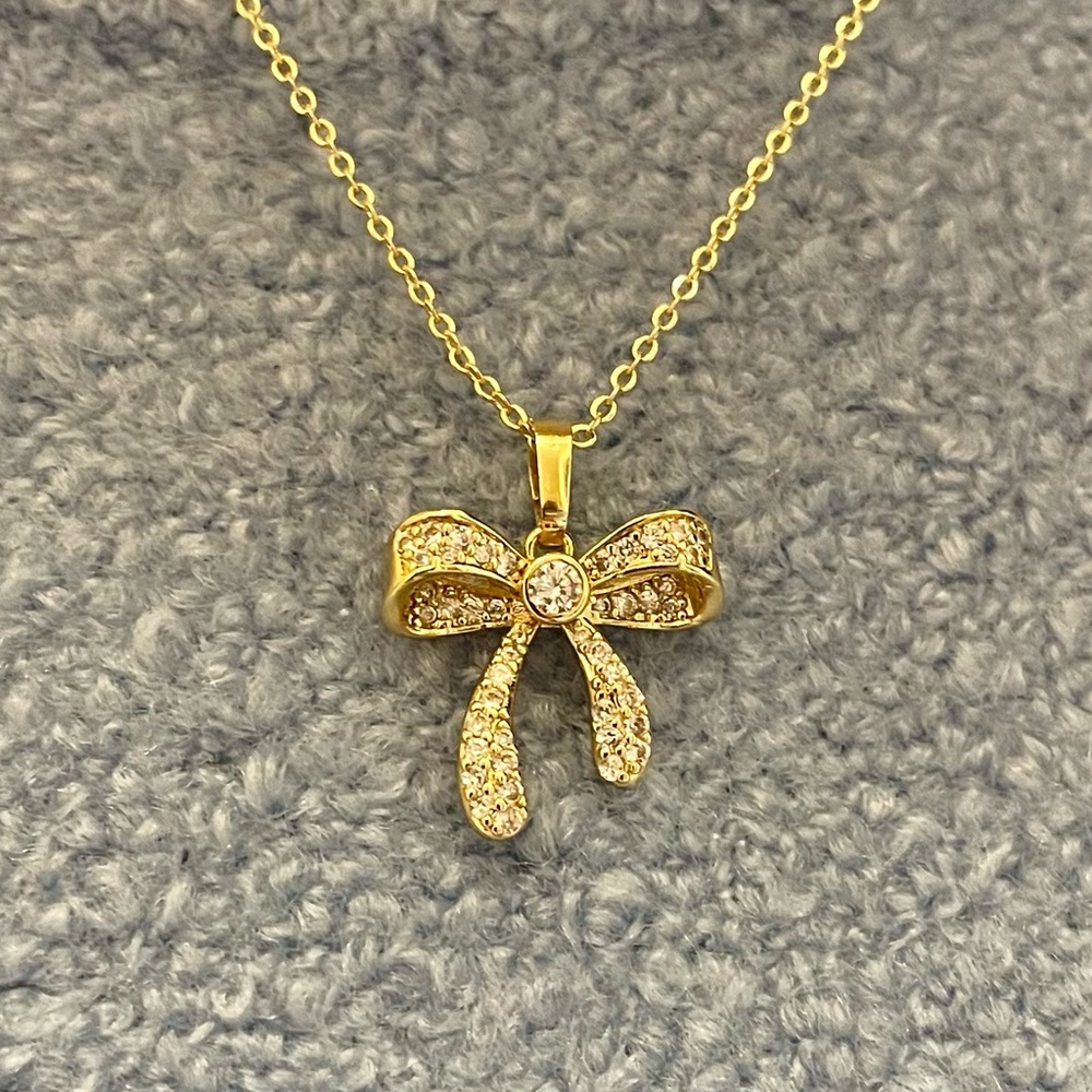 Bow tie necklace with pave stones, 18K gold plated, with 18” chain